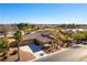 Aerial view of a house with a three-car garage and palm trees at 5024 Crown Cypress St, Las Vegas, NV 89149