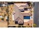 Overhead view of a single-story house with a tile roof and surrounding yard at 5024 Crown Cypress St, Las Vegas, NV 89149