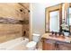 Modern bathroom with shower/tub combo, copper sink, and tile flooring at 5024 Crown Cypress St, Las Vegas, NV 89149