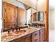 Bathroom with copper sinks and granite countertop at 5024 Crown Cypress St, Las Vegas, NV 89149