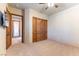 Bedroom with wood doors and carpet flooring at 5024 Crown Cypress St, Las Vegas, NV 89149