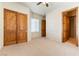 Bedroom with wood doors and carpet flooring at 5024 Crown Cypress St, Las Vegas, NV 89149