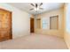 Well-lit bedroom with neutral decor and private door at 5024 Crown Cypress St, Las Vegas, NV 89149