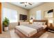 Virtually staged bedroom with wood bed frame at 5024 Crown Cypress St, Las Vegas, NV 89149