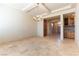 Dining room with access to kitchen and hallway, featuring a chandelier and tile flooring at 5024 Crown Cypress St, Las Vegas, NV 89149