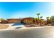 House with three-car garage, desert landscaping, and a walkway to the entry at 5024 Crown Cypress St, Las Vegas, NV 89149