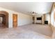 Open living room with tile flooring, a fireplace, and neutral-colored walls at 5024 Crown Cypress St, Las Vegas, NV 89149