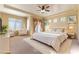 Luxurious main bedroom with comfy seating area and large bed at 5024 Crown Cypress St, Las Vegas, NV 89149