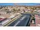 Aerial view of residential community with gated entrance at 5123 Mascaro Dr, Las Vegas, NV 89122