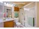 Bathroom features wood cabinets, a toilet, and a shower/tub combo at 5123 Mascaro Dr, Las Vegas, NV 89122