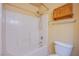 Bathroom with shower/tub combo and wood cabinet at 5123 Mascaro Dr, Las Vegas, NV 89122