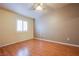 Bedroom featuring wood flooring and ceiling fan at 5123 Mascaro Dr, Las Vegas, NV 89122