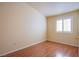 Bright bedroom featuring hardwood floors and window shutters at 5123 Mascaro Dr, Las Vegas, NV 89122