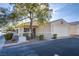 Single-story house with a two-car garage and landscaping at 5123 Mascaro Dr, Las Vegas, NV 89122