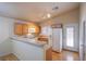 Bright kitchen with wood cabinets, granite countertops, and sliding door access at 5123 Mascaro Dr, Las Vegas, NV 89122