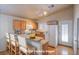 Kitchen with wood cabinets, granite counter, and a breakfast bar at 5123 Mascaro Dr, Las Vegas, NV 89122