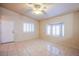 Living room with tile floors, neutral walls, and a bay window at 5123 Mascaro Dr, Las Vegas, NV 89122