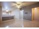 Living room with tile floors, neutral walls, and a view of the kitchen at 5123 Mascaro Dr, Las Vegas, NV 89122