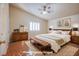 Spacious main bedroom with a king-size bed and wooden dresser at 5123 Mascaro Dr, Las Vegas, NV 89122