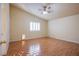 Large main bedroom with wood floors and a ceiling fan at 5123 Mascaro Dr, Las Vegas, NV 89122