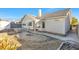 Landscaped backyard with patio, fire pit, and storage shed at 5125 Coral Beach St, North Las Vegas, NV 89031