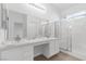 Elegant bathroom with double vanity, marble countertop, and shower at 5125 Coral Beach St, North Las Vegas, NV 89031