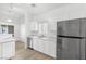 Modern kitchen with stainless steel appliances and white cabinets at 5125 Coral Beach St, North Las Vegas, NV 89031