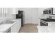 Clean kitchen, featuring stainless steel appliances and white cabinets at 5125 Coral Beach St, North Las Vegas, NV 89031