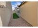 Landscaped backyard with artificial turf and gravel at 540 Front Range Ln, North Las Vegas, NV 89084