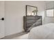 Modern bedroom with dresser and large mirror at 540 Front Range Ln, North Las Vegas, NV 89084