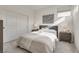 Cozy bedroom with queen bed and wood dresser at 540 Front Range Ln, North Las Vegas, NV 89084