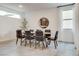 Modern dining room with wood table and six chairs at 540 Front Range Ln, North Las Vegas, NV 89084