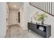 Stylish entryway with modern console table and mirror at 540 Front Range Ln, North Las Vegas, NV 89084