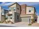 Contemporary two-story house with attached garage and front yard at 540 Front Range Ln, North Las Vegas, NV 89084