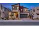 Modern two-story home with attached garage and landscaped front yard at 540 Front Range Ln, North Las Vegas, NV 89084