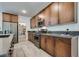 Modern kitchen with stainless steel appliances and wood cabinets at 540 Front Range Ln, North Las Vegas, NV 89084