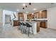 Modern kitchen with island, stainless steel appliances, and ample cabinetry at 540 Front Range Ln, North Las Vegas, NV 89084