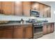 Modern kitchen with stainless steel appliances and ample counter space at 540 Front Range Ln, North Las Vegas, NV 89084