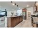 Open concept kitchen with island and stainless steel appliances at 540 Front Range Ln, North Las Vegas, NV 89084