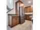 Kitchen with stainless steel refrigerator and wood cabinetry at 540 Front Range Ln, North Las Vegas, NV 89084