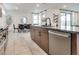 Open kitchen with island and stainless steel dishwasher at 540 Front Range Ln, North Las Vegas, NV 89084