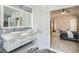 Elegant bathroom with double sinks and a view into the bedroom at 7000 W Rome Blvd, Las Vegas, NV 89131