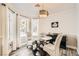 Bright dining area with glass table, chairs and large windows at 7000 W Rome Blvd, Las Vegas, NV 89131