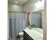 Bathroom with shower/tub combo and gray shower curtain at 7914 Torreys Peak St, Las Vegas, NV 89166