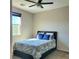 Guest bedroom with a ceiling fan and a queen-size bed at 7914 Torreys Peak St, Las Vegas, NV 89166