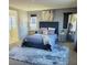 Main bedroom with plush carpet and a large window at 7914 Torreys Peak St, Las Vegas, NV 89166