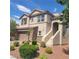 Two-story house with a brown garage door and landscaped yard at 7914 Torreys Peak St, Las Vegas, NV 89166