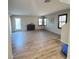 Spacious living room featuring hardwood floors and large windows at 7914 Torreys Peak St, Las Vegas, NV 89166