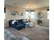 Spacious living room featuring a sectional sofa and stylish coffee table at 7914 Torreys Peak St, Las Vegas, NV 89166