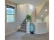 Modern staircase with light colored risers and neutral carpeting at 7914 Torreys Peak St, Las Vegas, NV 89166